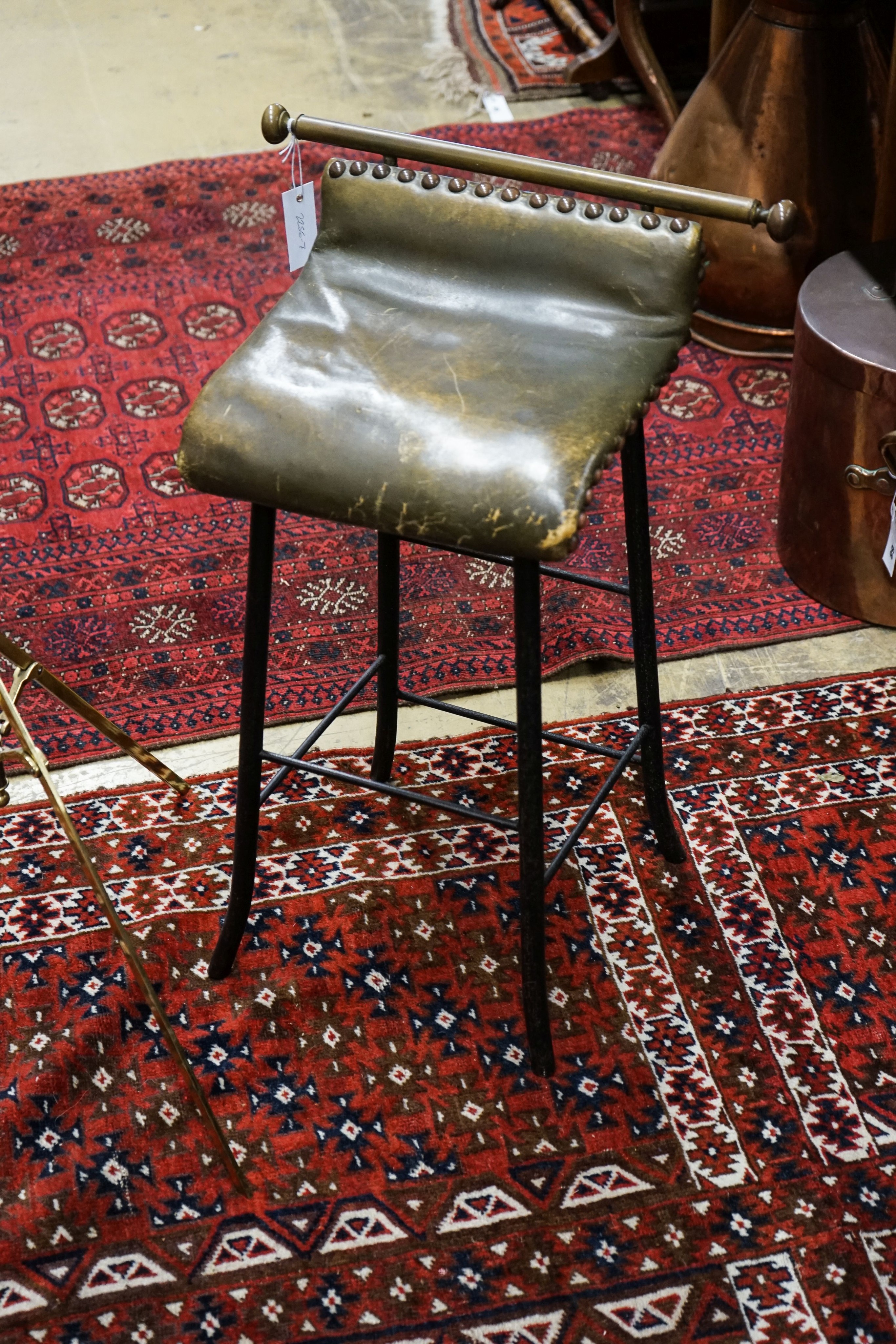 An Edwardian brass music stand and stool